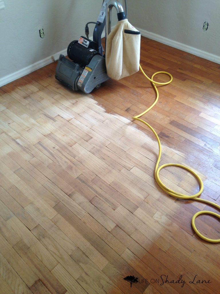 How to Refinish Wood Floors - a complete, step-by-step guide to refinishing wood floors by yourself instead of paying TONS of money for someone else to do it! Save money and get the exact look you want | #diy #woodflooring 