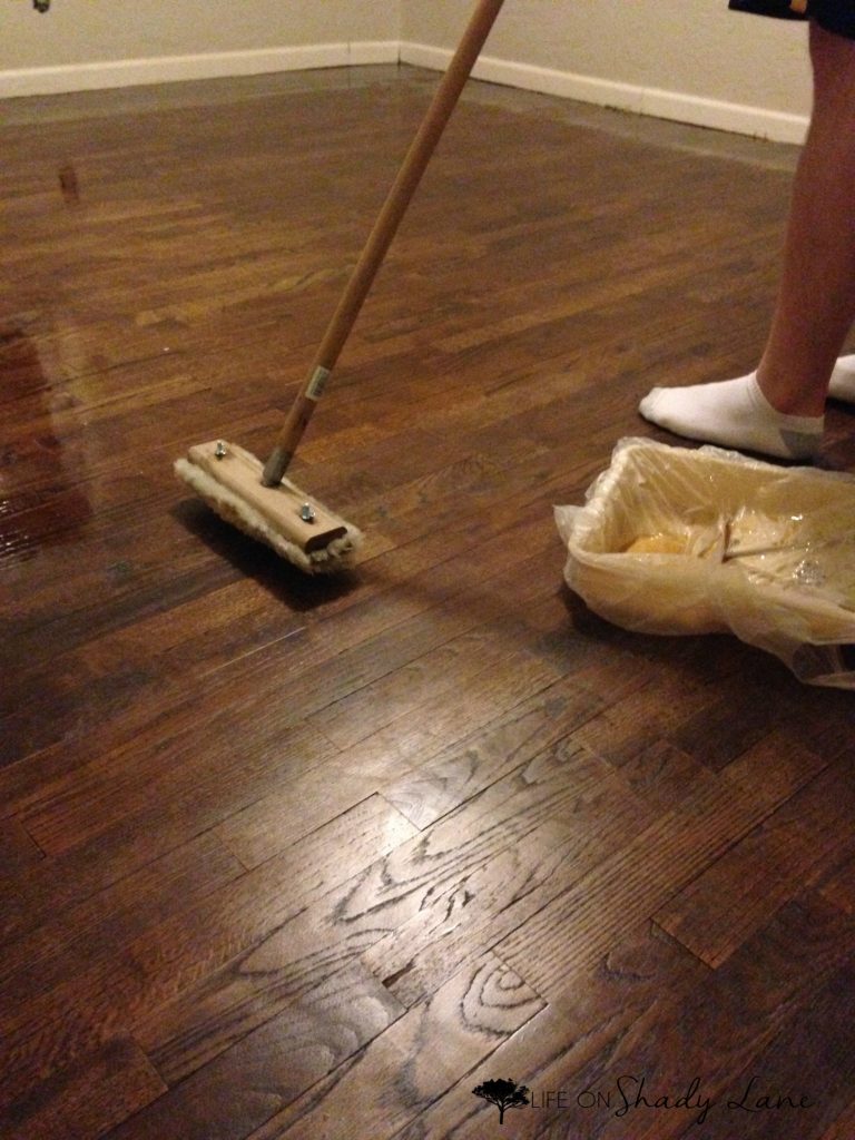 How to Refinish Wood Floors - a complete, step-by-step guide to refinishing wood floors by yourself instead of paying TONS of money for someone else to do it! Save money and get the exact look you want | #diy #woodflooring 