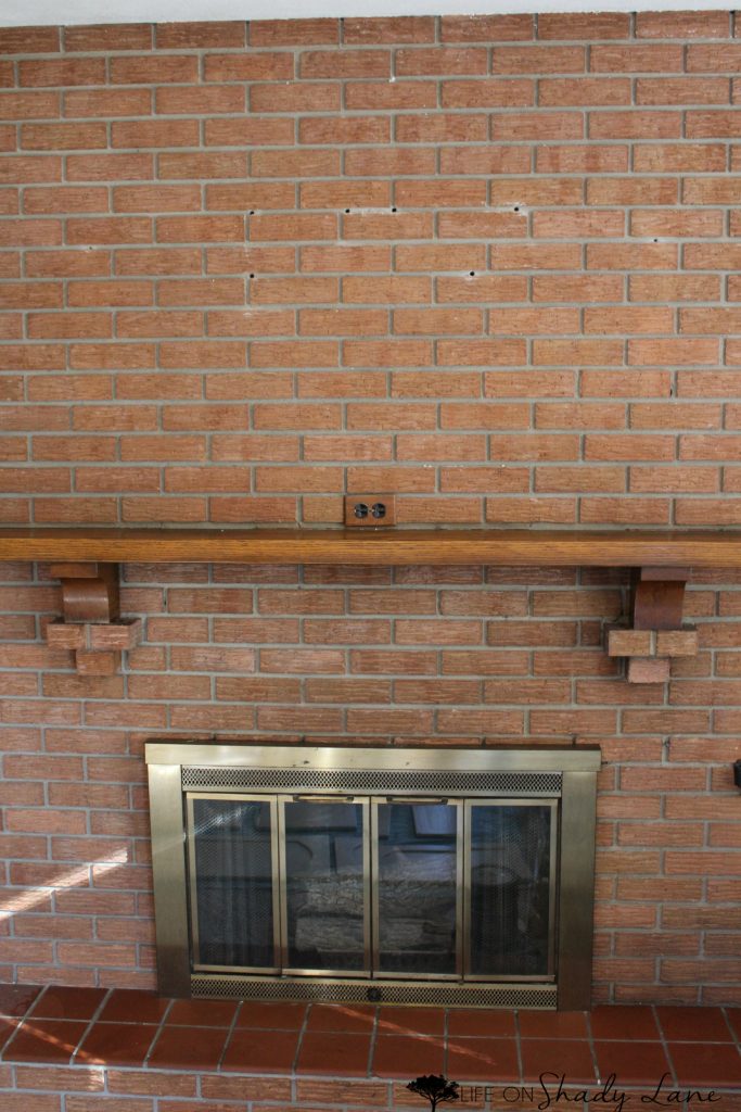 How to Whitewash a Brick Fireplace via Life on Shady Lane blog || Kansas City life, home, and style blogger Megan Wilson shares a step by step fireplace makeover guide! || www.lifeonshadylane.com 