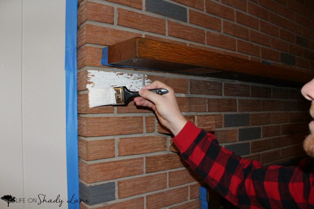 How to Whitewash a Brick Fireplace via Life on Shady Lane blog || Kansas City life, home, and style blogger Megan Wilson shares a step by step fireplace makeover guide! || www.lifeonshadylane.com 