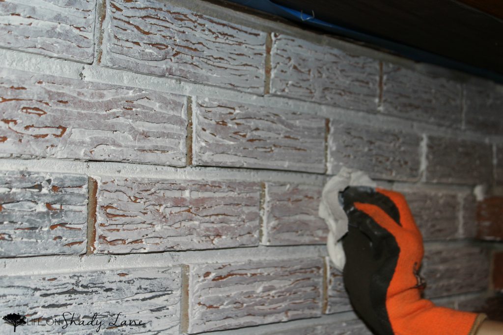 How to Whitewash a Brick Fireplace via Life on Shady Lane blog || Kansas City life, home, and style blogger Megan Wilson shares a step by step fireplace makeover guide! || www.lifeonshadylane.com 