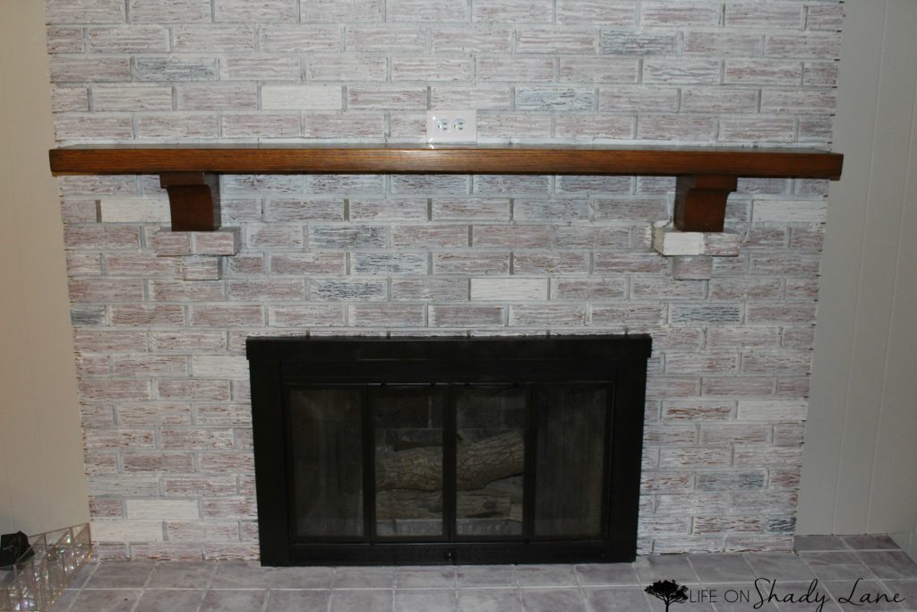 How to Whitewash a Brick Fireplace via Life on Shady Lane blog || Kansas City life, home, and style blogger Megan Wilson shares a step by step fireplace makeover guide! || www.lifeonshadylane.com 