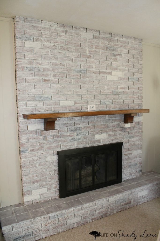 How to Whitewash a Brick Fireplace via Life on Shady Lane blog || Kansas City life, home, and style blogger Megan Wilson shares a step by step fireplace makeover guide! || www.lifeonshadylane.com 