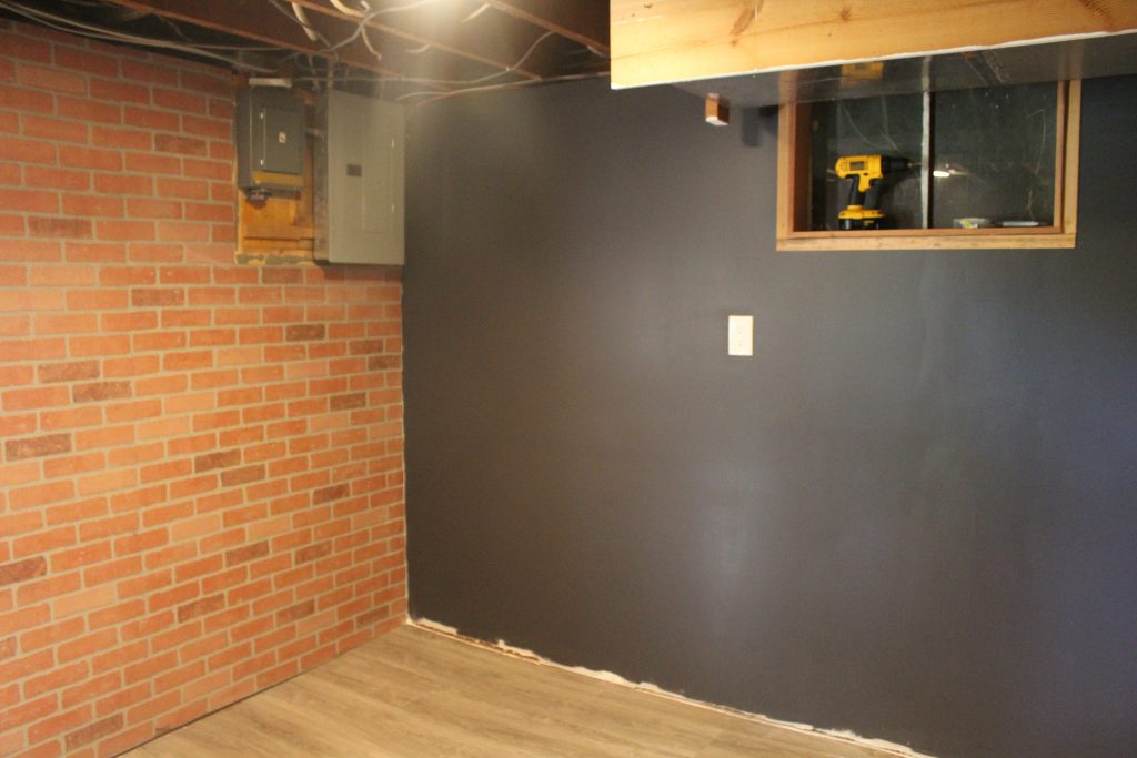Man Cave Update: Painted Drywall and Flooring via Life on Shady Lane blog