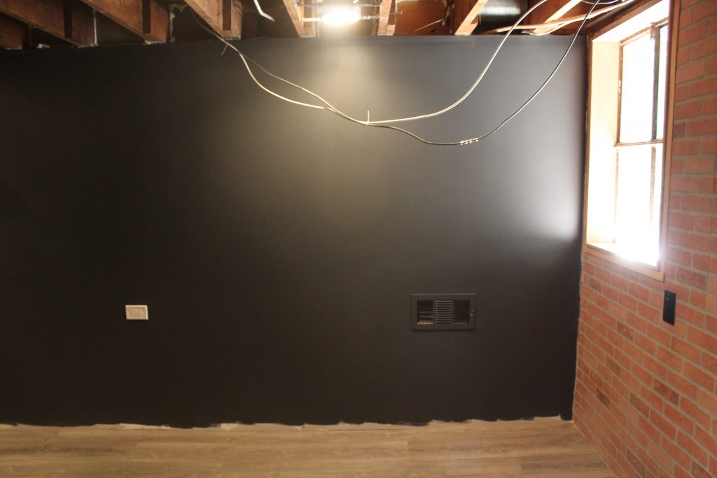 Man Cave Update: Painted Drywall and Flooring via Life on Shady Lane blog