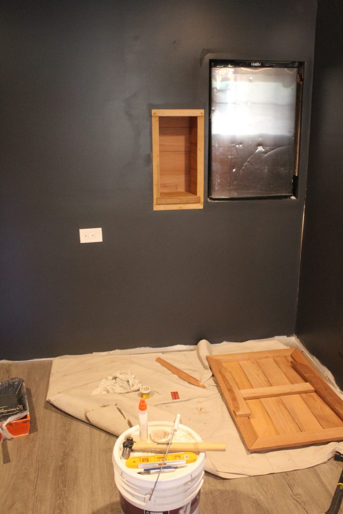 Man Cave Update: Painted Drywall and Flooring via Life on Shady Lane Blog