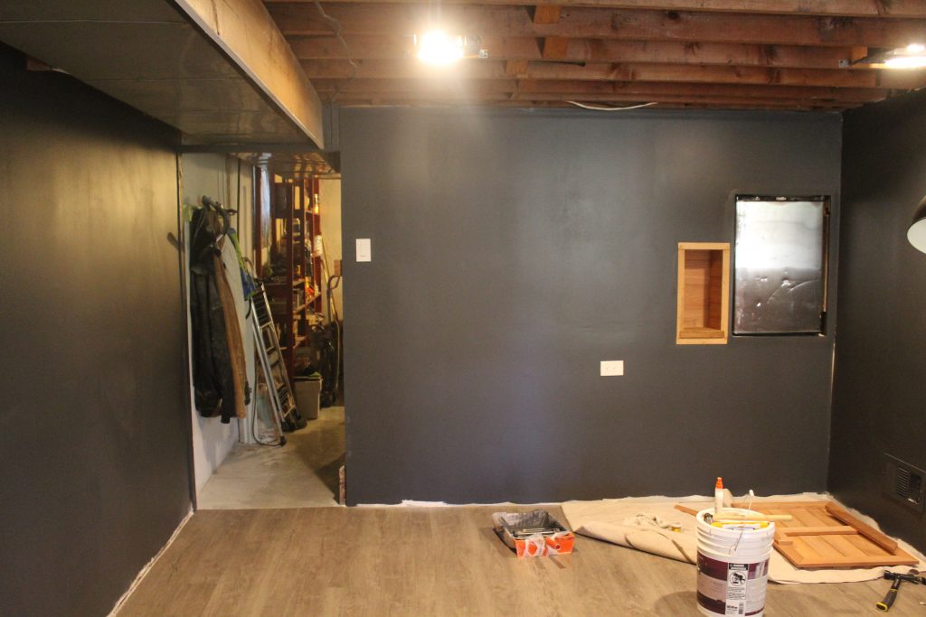 Man Cave Update: Painted Drywall and Flooring via Life on Shady Lane blog