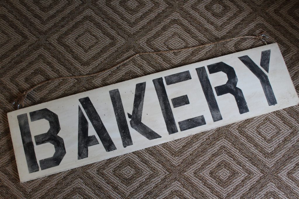 DIY: Antiqued Painted Sign // How to make a new, freshly painted sign look antique