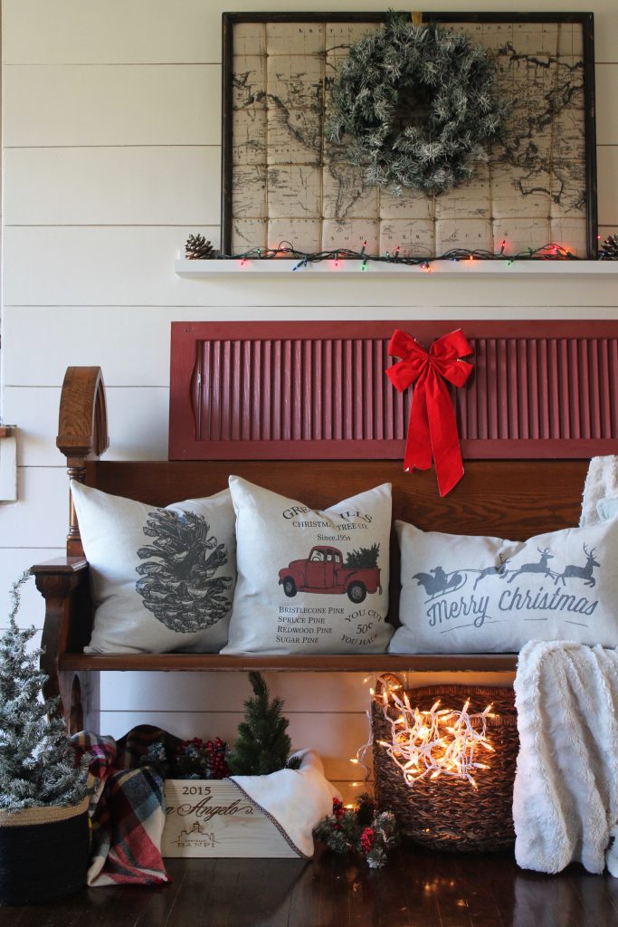 Antique church pew and christmas pillows via Life on Shady Lane blog