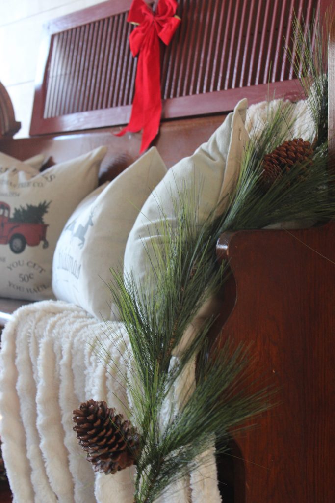 Antique church pew and Christmas pillows via Life on Shady Lane blog