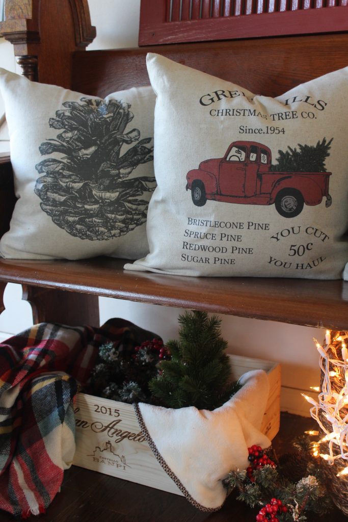 Antique church pew and christmas pillows via Life on Shady Lane blog