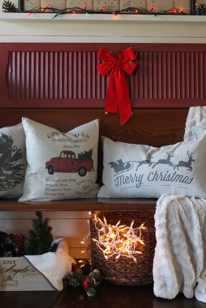 Antique church pew and christmas pillows via Life on Shady Lane blog