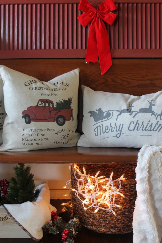 Antique church pew and christmas pillows via Life on Shady Lane blog