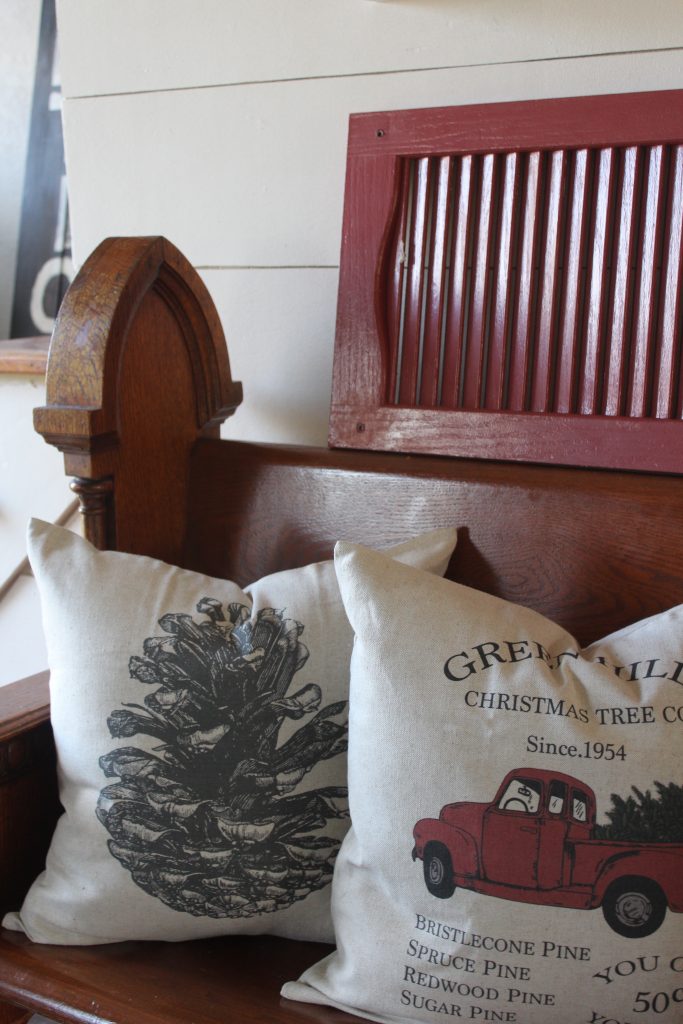 Antique church pew and christmas pillows via Life on Shady Lane blog