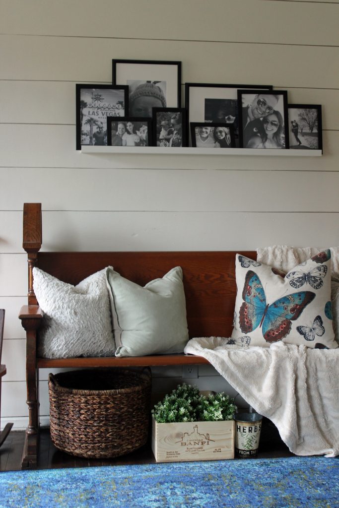 Blue runner rug, shiplap wall, black and white family photos | A pop of blue, modern farmhouse entryway via Life on Shady Lane blog 