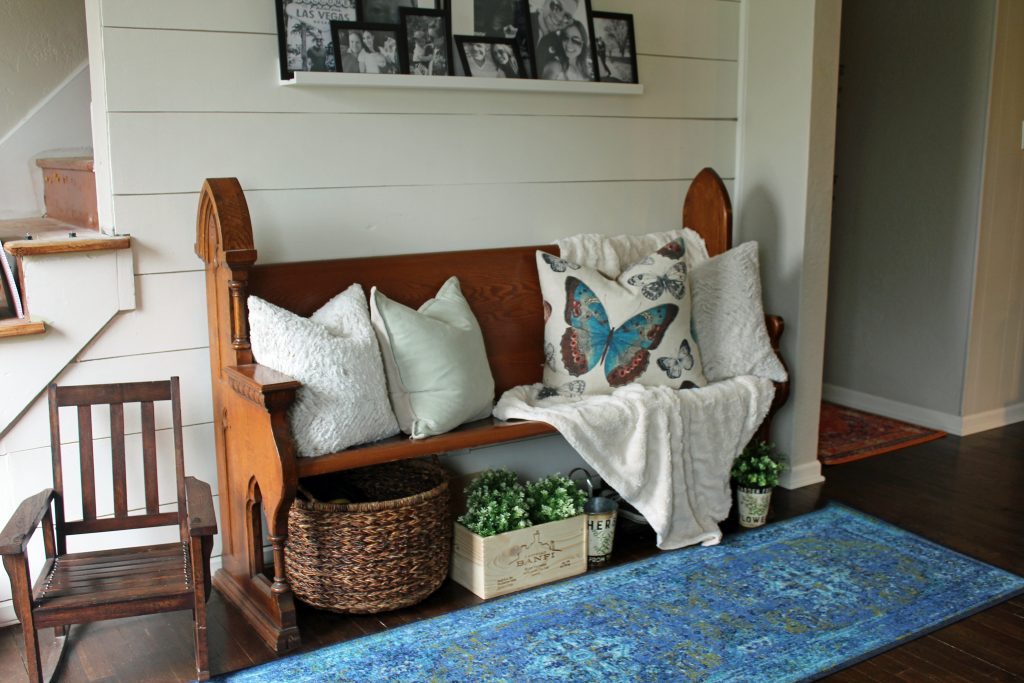 Blue runner rug, shiplap wall, black and white family photos | A pop of blue, modern farmhouse entryway via Life on Shady Lane blog 