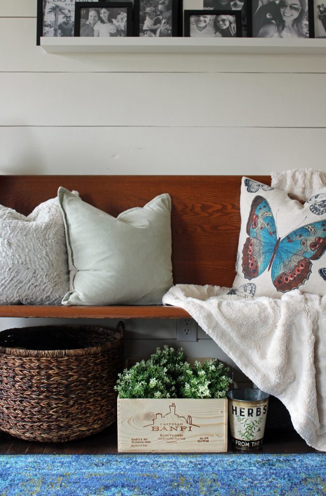 Blue runner rug, shiplap wall, black and white family photos | A pop of blue, modern farmhouse entryway via Life on Shady Lane blog 