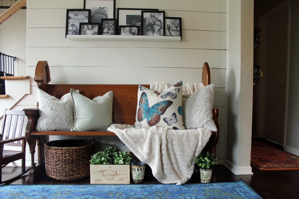 Blue runner rug, shiplap wall, black and white family photos | A pop of blue, modern farmhouse entryway via Life on Shady Lane blog 