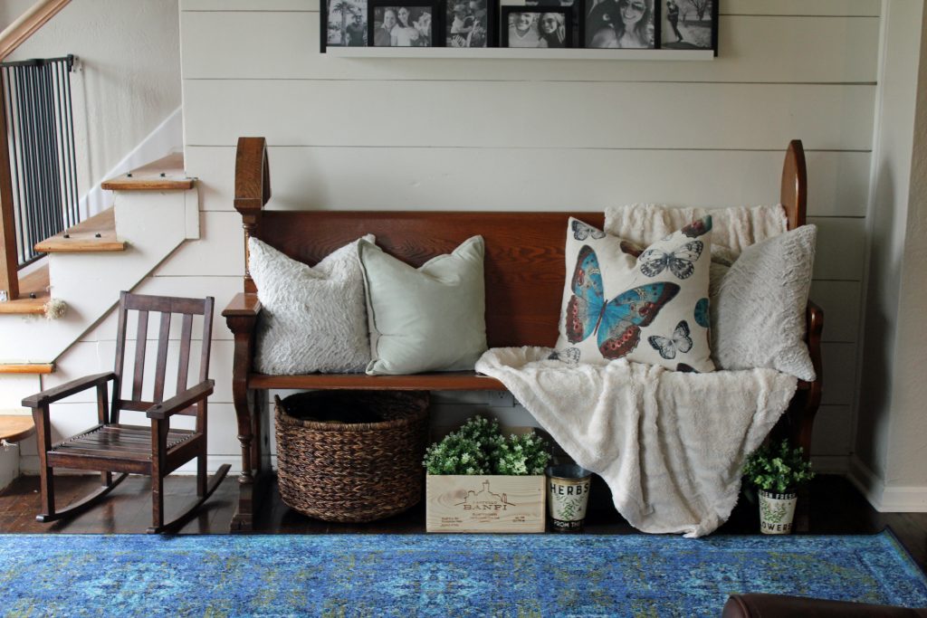 Blue runner rug, shiplap wall, black and white family photos | A pop of blue, modern farmhouse entryway via Life on Shady Lane blog 