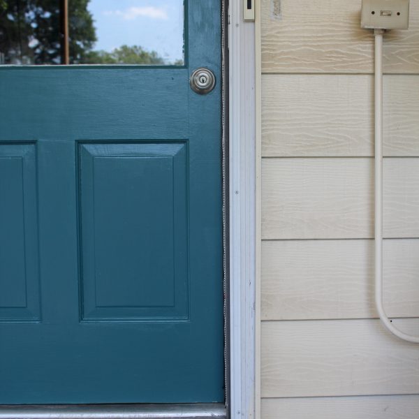 A quick and easy door makeover, teal exterior door and yellow house