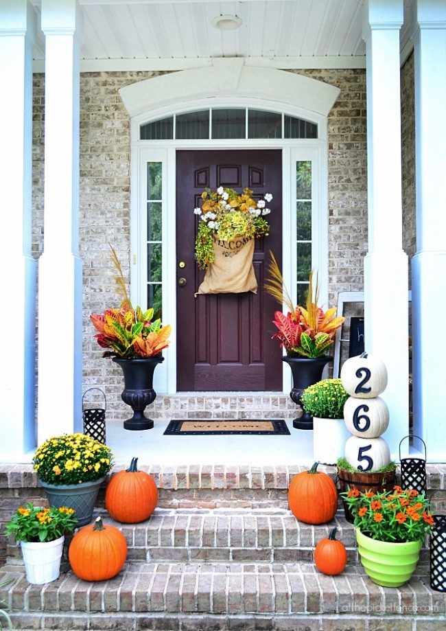 Inspiring Fall Porches - a roundup complete with traditional and non-traditional autumn colors, so there's something for everyone! 