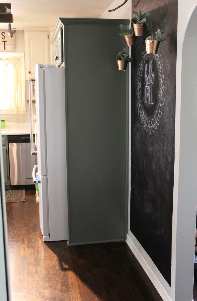 Chalkboard wall with hanging copper planters - perfect for turning a big, blank kitchen wall into something that is stylish, fun, and functional! 