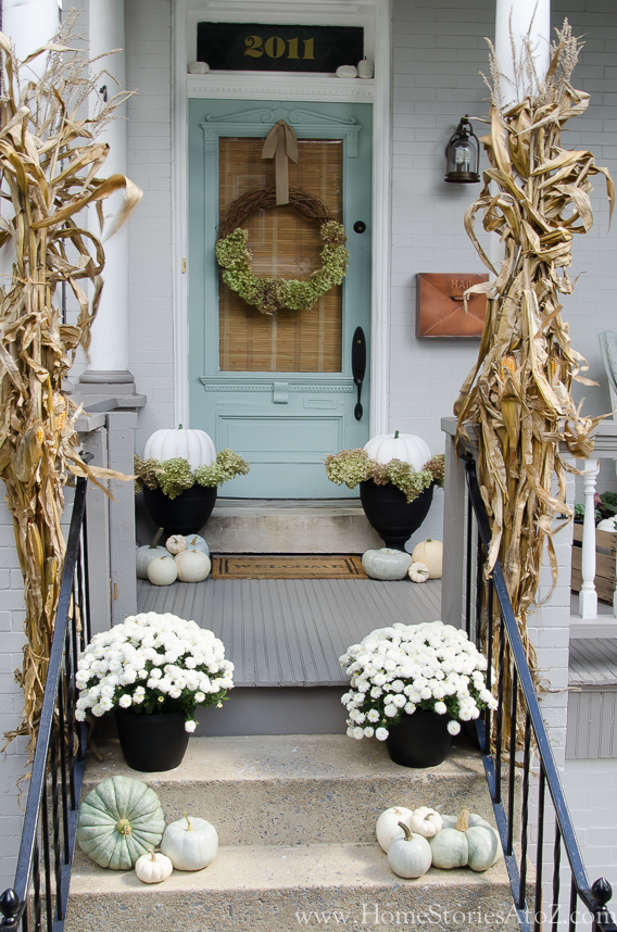 Inspiring Fall Porches - a roundup complete with traditional and non-traditional autumn colors, so there's something for everyone! 