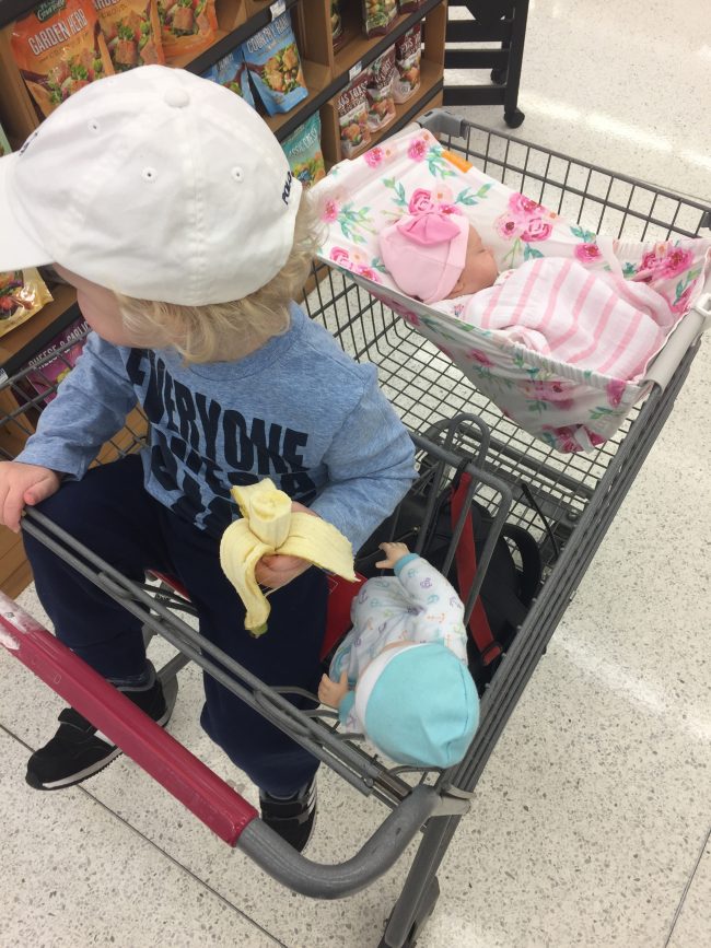 Mom hack: A shopping cart hammock for baby so there's more room in the cart for your groceries and Target 