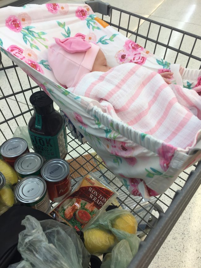 Mom hack: A shopping cart hammock for baby so there's more room in the cart for your groceries and Target 