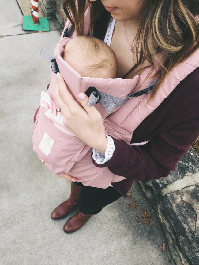 A blush pink organic cotton baby carrier - must have for moms of littles!