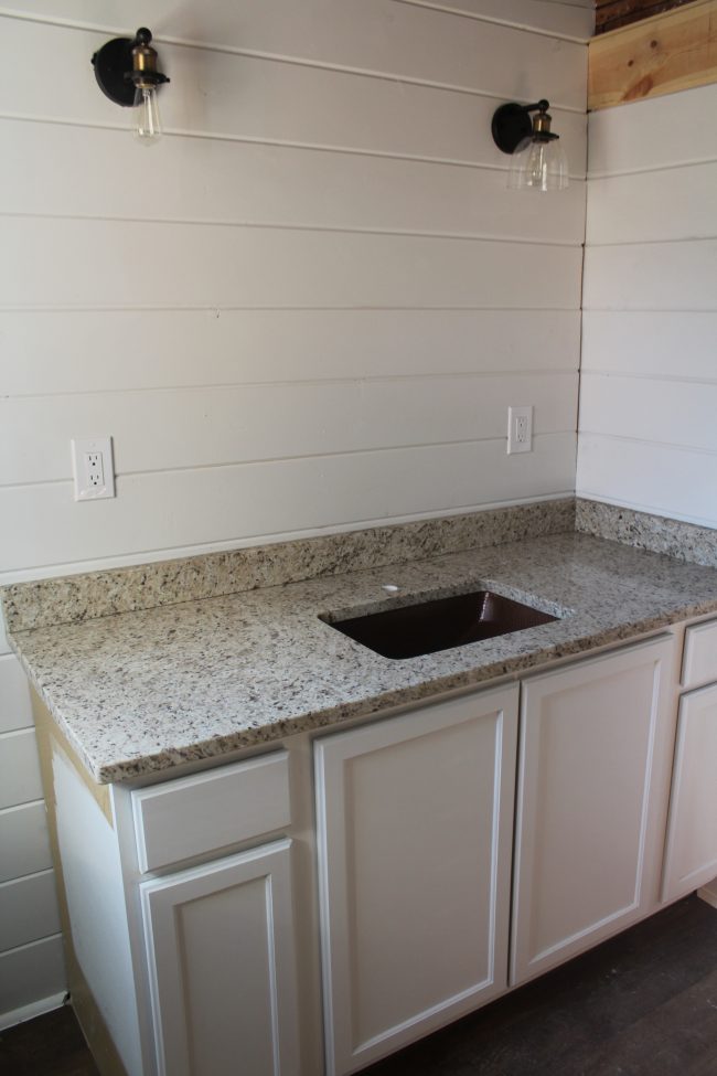 Modern farmhouse bathroom remodel: copper sink and granite countertops