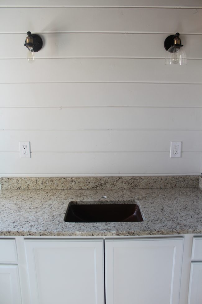 Modern farmhouse bathroom remodel: copper sink and granite countertops