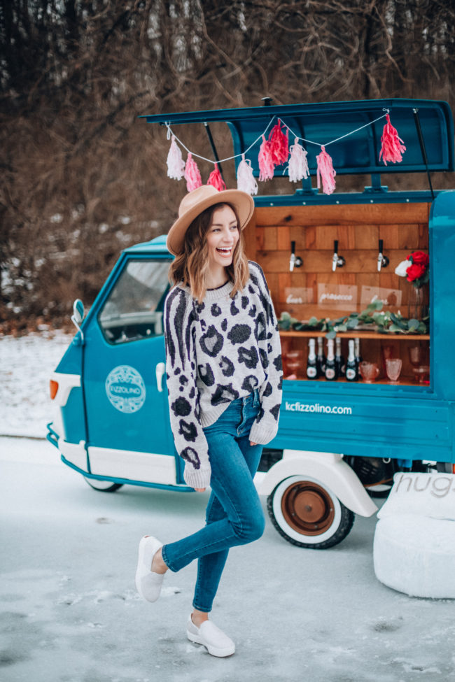 Animal print sweater and jeans, white sneakers | What is Galentine's Day? Here's what it is...and how to celebrate! | How to celebrate Galentine's Day | Kansas City life, home, and style blogger Megan Wilson shares ten ways to celebrate Galentine's Day! 