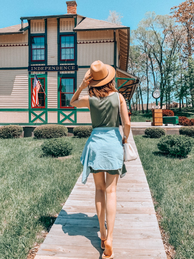 Green tank dress, chambray shirt, and hat outfit || Casual spring and summer style || Chicago & Alton Railroad Depot in Independence, Missouri || Kansas City life, home, and style Blogger Megan Wilson shares a staycation trip to Independence, Missouri! #lovethesquare #staycation #visitmissouri