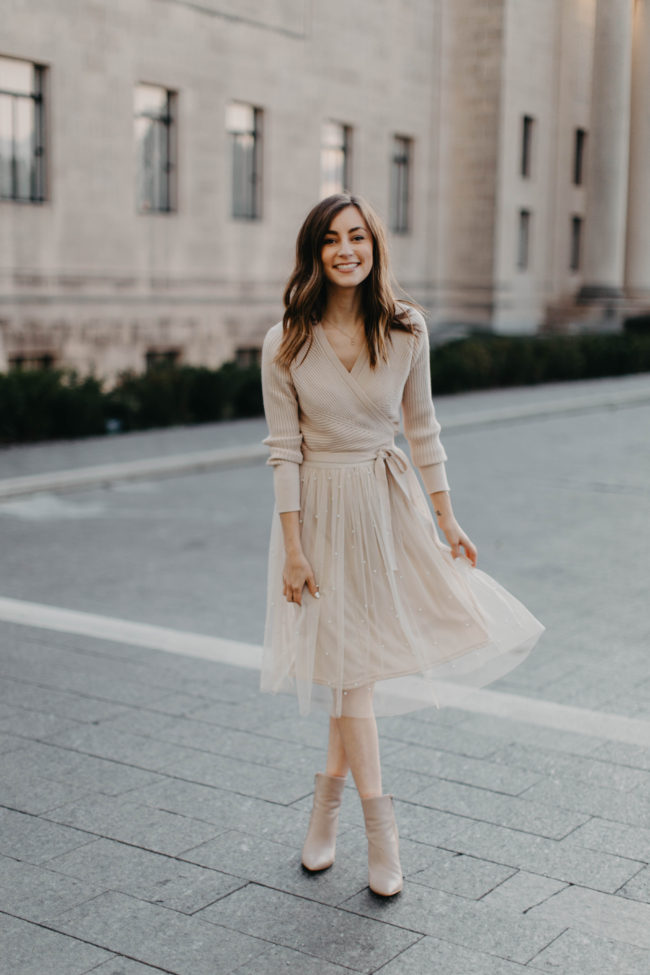 Neutral Skirts aren't just for spring and summer - I love to wear them in the fall paired with a sweater and even boots when the weather gets chillier! I wore a neutral skirt + wrap top for family pictures a few years ago, and that post has gone a bit viral since then. Unfortunately, I think the skirt I wore sold out - so I'm linking several similar options here for you today! | Kansas City life, home, and style blogger Megan Wilson @itsmegwilson on Instagram