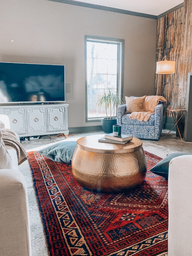 A unique, hammered gold coffee table WITH STORAGE! || Kansas City life, home, and style blogger Megan Wilson shares an update to her living room