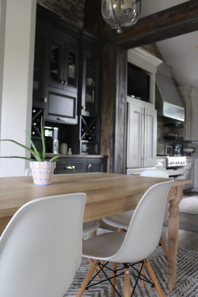 Light wood anthropologie dining table and white chairs || Dining room inspiration || Kansas City life, home, and style blogger Megan Wilson shares a tour of her home, recently featured in Kansas City magazine