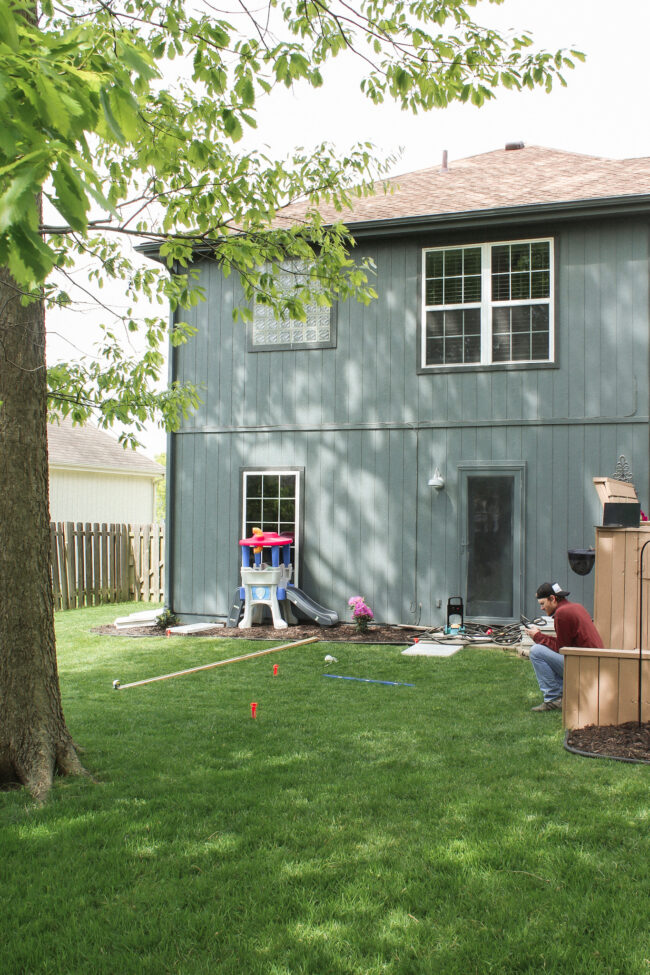 DIY paver patio and firepit - How to build your own patio and firepit! Patio with grass between pavers || Kansas City life, home, and style blogger Megan Wilson shares how to build your own patio and fire pit! 