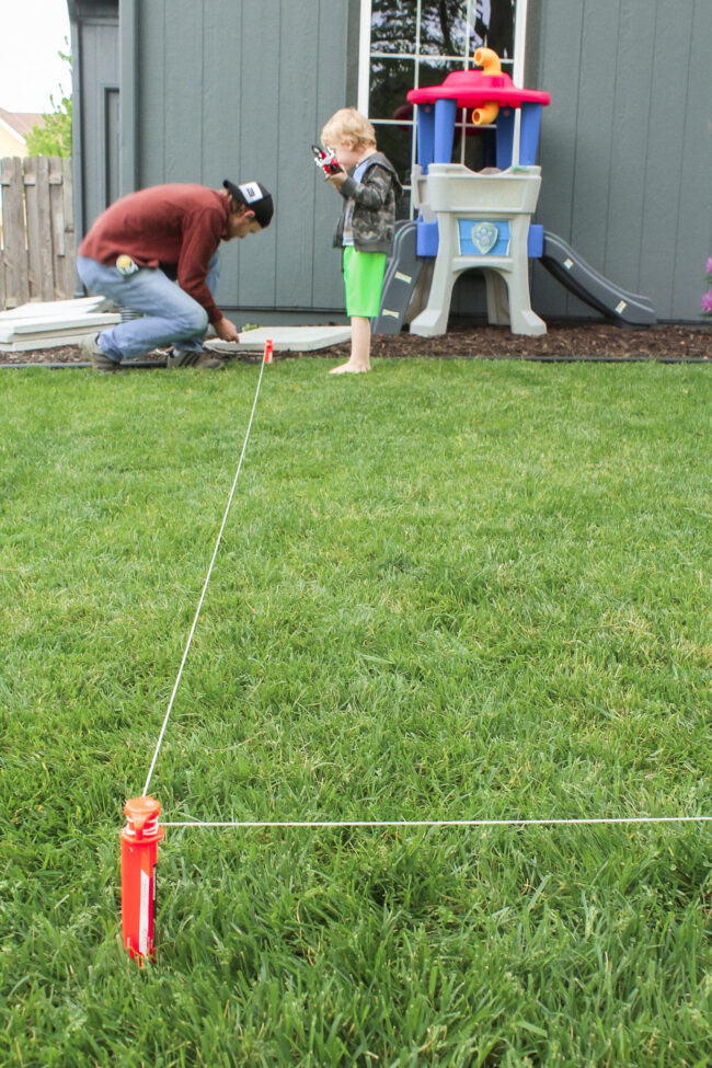 DIY paver patio and firepit - How to build your own patio and firepit! Patio with grass between pavers || Kansas City life, home, and style blogger Megan Wilson shares how to build your own patio and fire pit! 