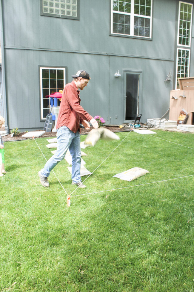 DIY paver patio and firepit - How to build your own patio and firepit! Patio with grass between pavers || Kansas City life, home, and style blogger Megan Wilson shares how to build your own patio and fire pit! 