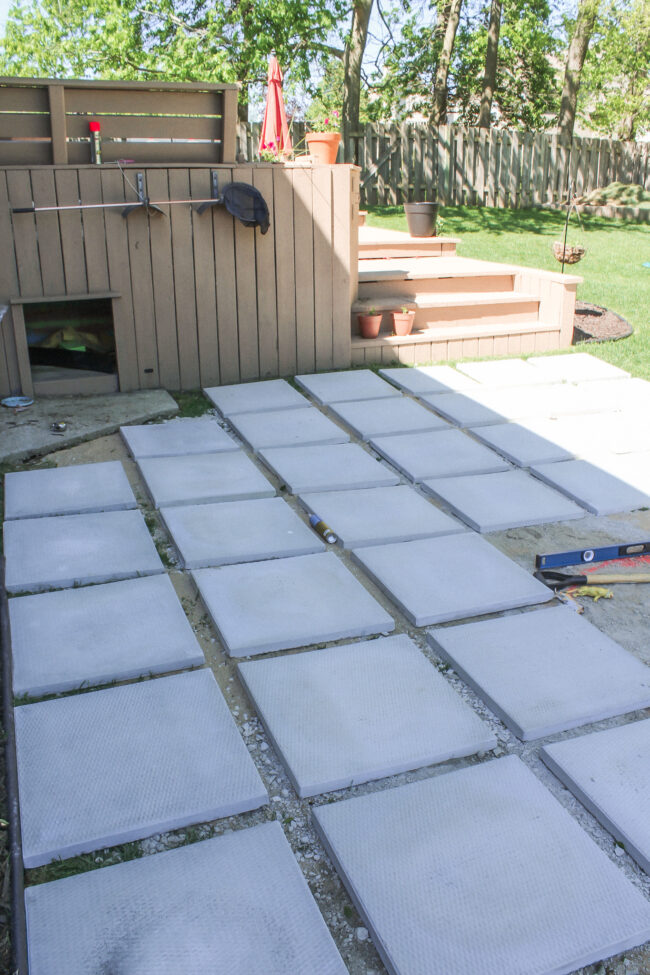 DIY paver patio and firepit - How to build your own patio and firepit! Patio with grass between pavers || Kansas City life, home, and style blogger Megan Wilson shares how to build your own patio and fire pit! 