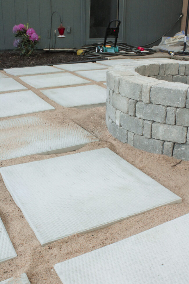 DIY paver patio and firepit - How to build your own patio and firepit! Patio with grass between pavers || Kansas City life, home, and style blogger Megan Wilson shares how to build your own patio and fire pit! 