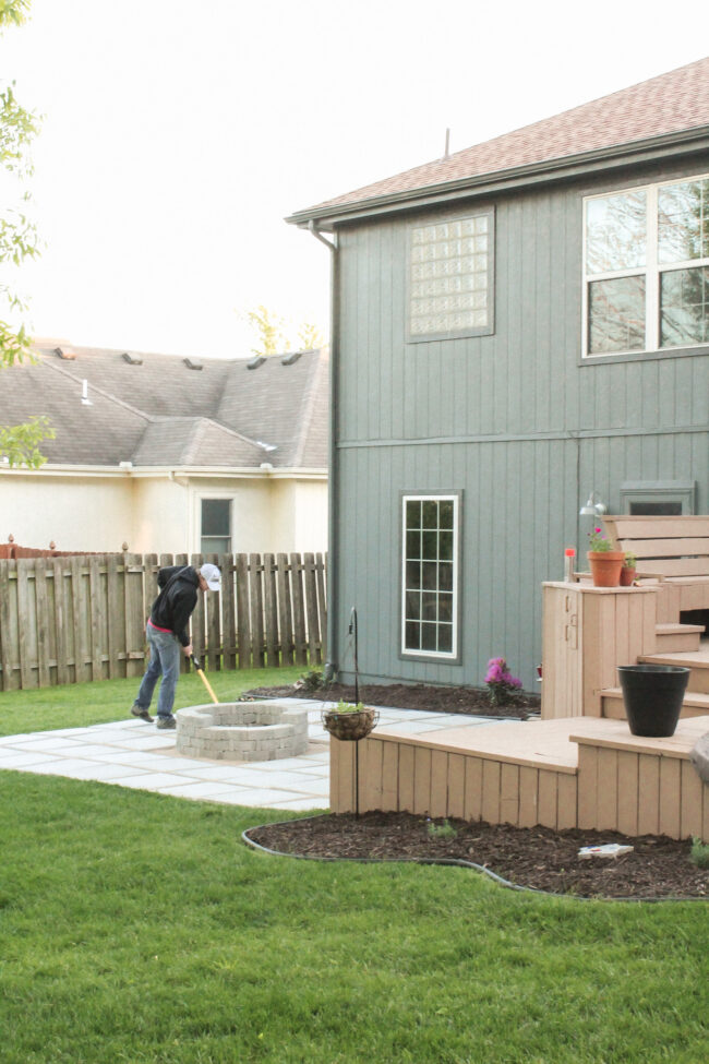 DIY paver patio and firepit - How to build your own patio and firepit! Patio with grass between pavers || Kansas City life, home, and style blogger Megan Wilson shares how to build your own patio and fire pit! 