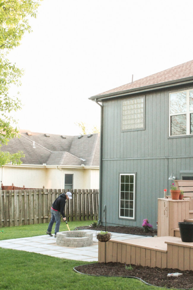 DIY paver patio and firepit - How to build your own patio and firepit! Patio with grass between pavers || Kansas City life, home, and style blogger Megan Wilson shares how to build your own patio and fire pit! 