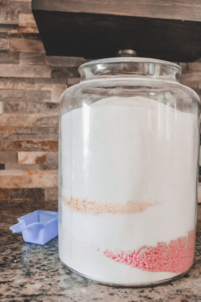 A DIY laundry detergent recipe that's super simple to put together and will save you money (and look pretty on your laundry room shelf!) || Kansas City life, home, and style blogger Megan Wilson shares her DIY laundry detergent recipe!