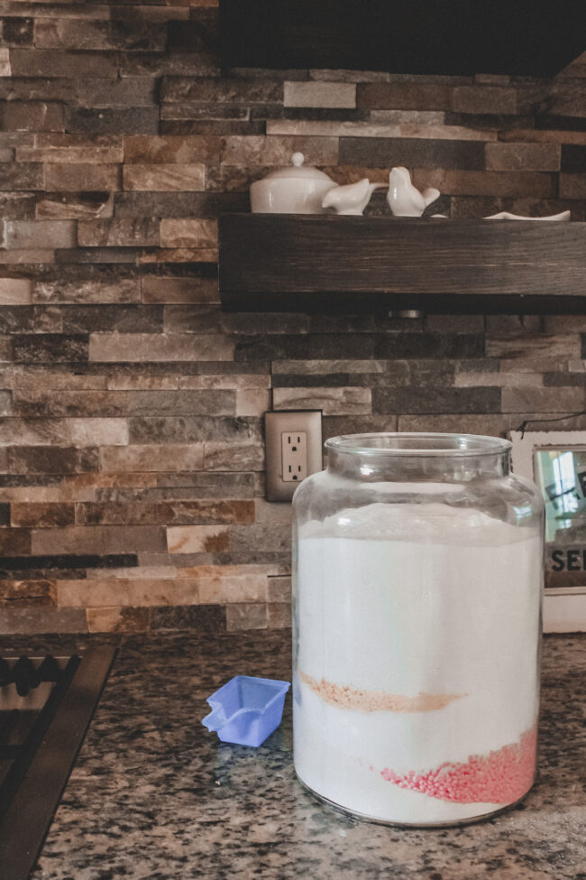 A DIY laundry detergent recipe that's super simple to put together and will save you money (and look pretty on your laundry room shelf!) || Kansas City life, home, and style blogger Megan Wilson shares her DIY laundry detergent recipe!