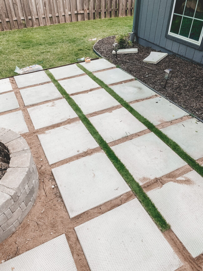 DIY paver patio and firepit - How to build your own patio and firepit! Patio with grass between pavers || Kansas City life, home, and style blogger Megan Wilson shares how to build your own patio and fire pit! 