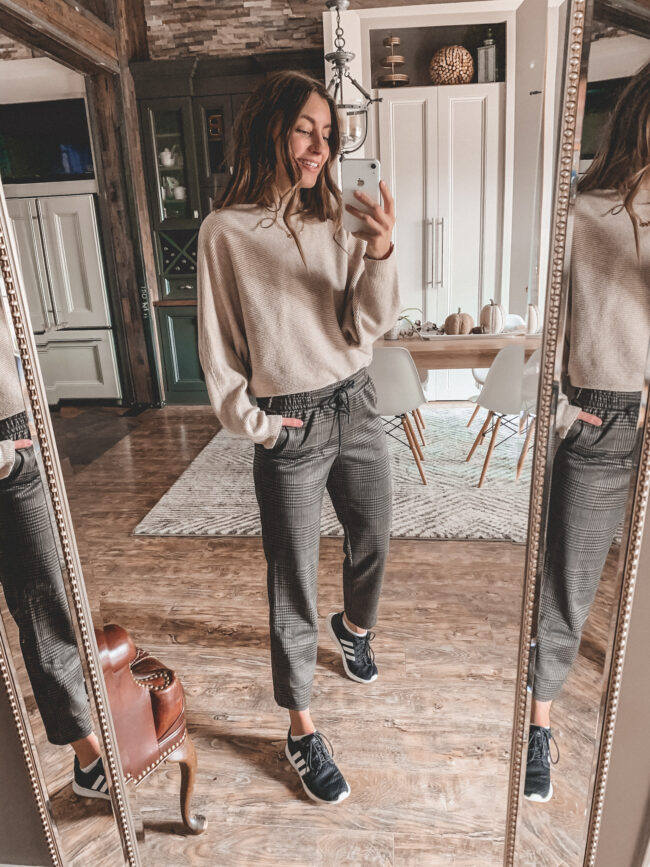 Neutral fall outfit with sneakers, plaid pants and tan sweater, black adidas sneakers, fall outfits 2020