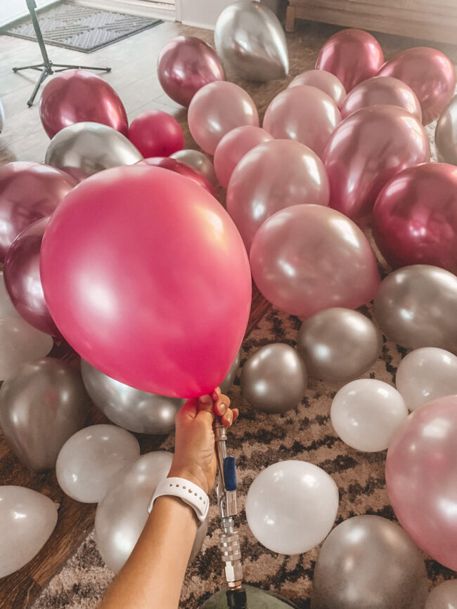 How to make a balloon garland! This post will show you a step-by-step guide to creating your own beautiful balloon garland or balloon arch. #balloongarland