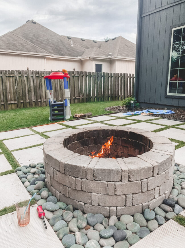 DIY paver patio and firepit - How to build your own patio and firepit! Patio with grass between pavers || Kansas City life, home, and style blogger Megan Wilson shares how to build your own patio and fire pit! 